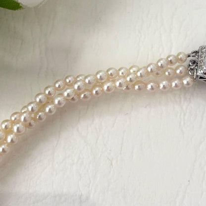 428 Tasaki silver necklace with three rows of approximately 2.7-2.9mm pearls and silver clasp