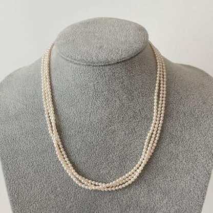 428 Tasaki silver necklace with three rows of approximately 2.7-2.9mm pearls and silver clasp