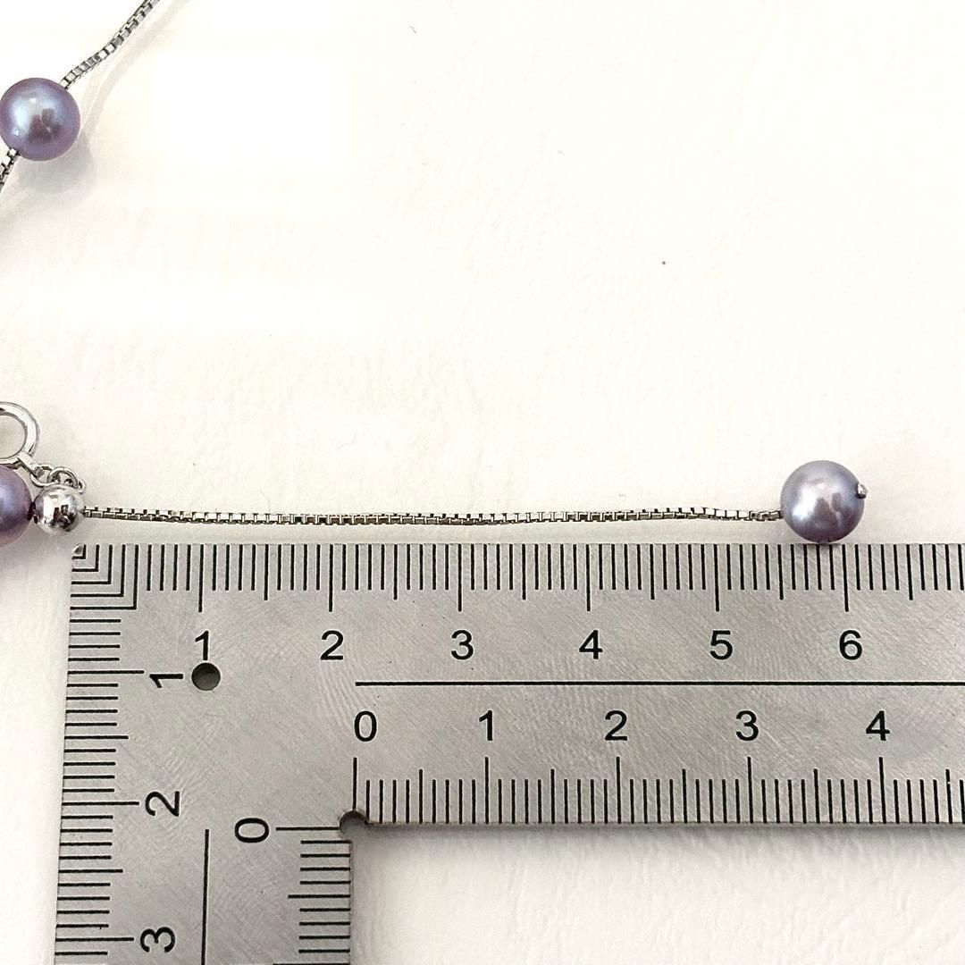 186Tasaki K18 station necklace with purple pearls, 44cm adjustable chain on white background