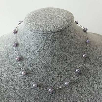 186Tasaki K18 station necklace with purple pearls, 44cm adjustable chain on white background