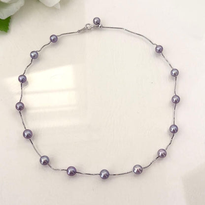 186Tasaki K18 station necklace with purple pearls, 44cm adjustable chain on white background
