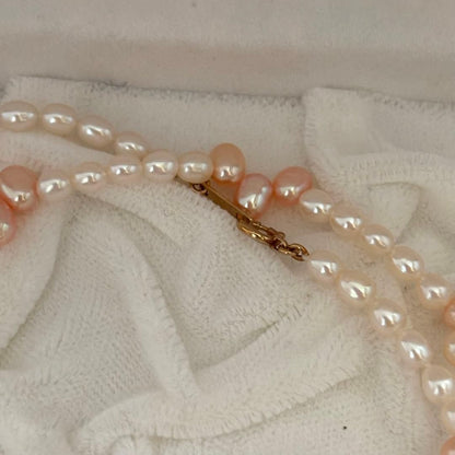 Close-up of 393 Tasaki K18 gold necklace with pearls measuring 47.5 cm length