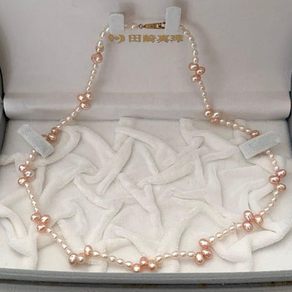 Close-up of 393 Tasaki K18 gold necklace with pearls measuring 47.5 cm length