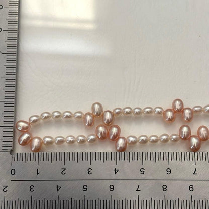 Close-up of 393 Tasaki K18 gold necklace with pearls measuring 47.5 cm length