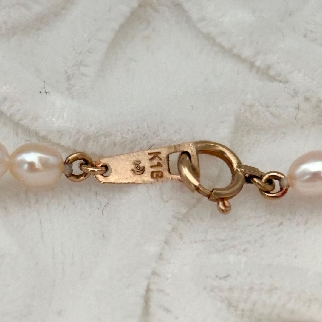 Close-up of 393 Tasaki K18 gold necklace with pearls measuring 47.5 cm length