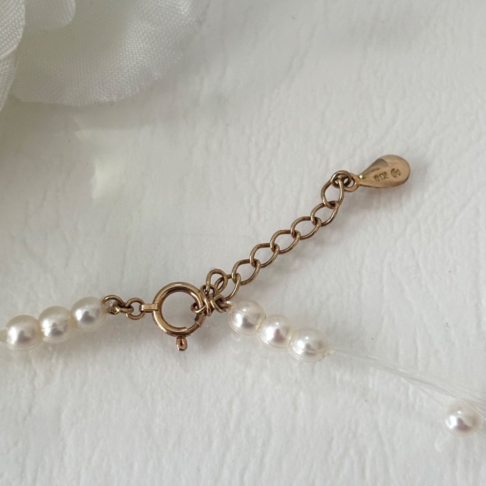 250Tasaki K18 8-row pearl necklace with white and purple pearls, 43 cm long