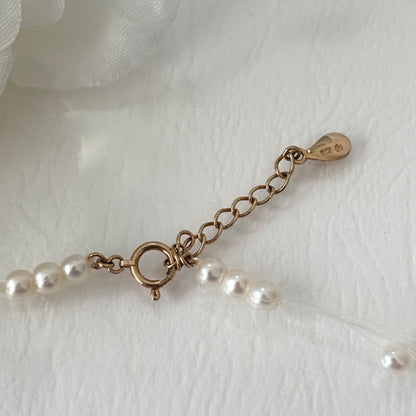 250Tasaki K18 8-row pearl necklace with white and purple pearls, 43 cm long