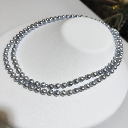 Akoya pearl treatment necklace featuring 5mm pearls and 80cm length on a white background