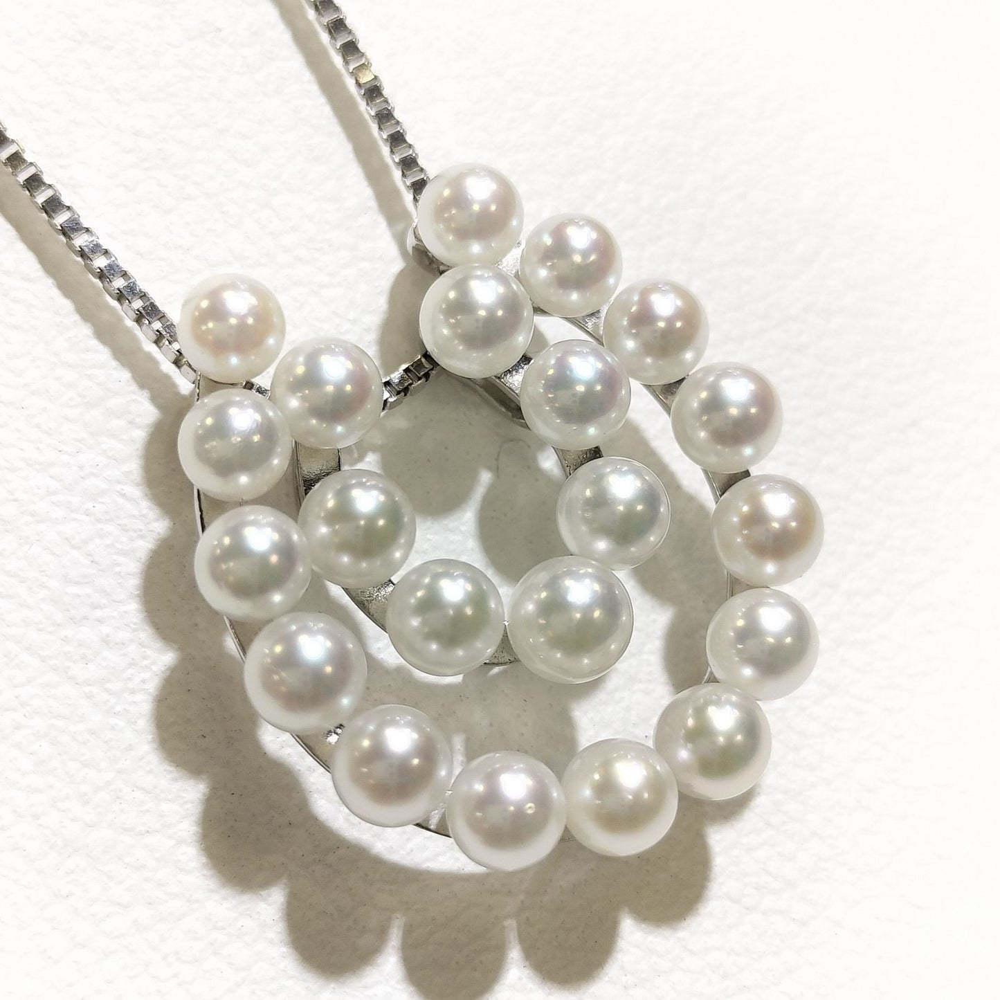 Akwoya Pearl Horseshoe Pendant Necklace with two horseshoe charms and small pearls on a 50cm chain