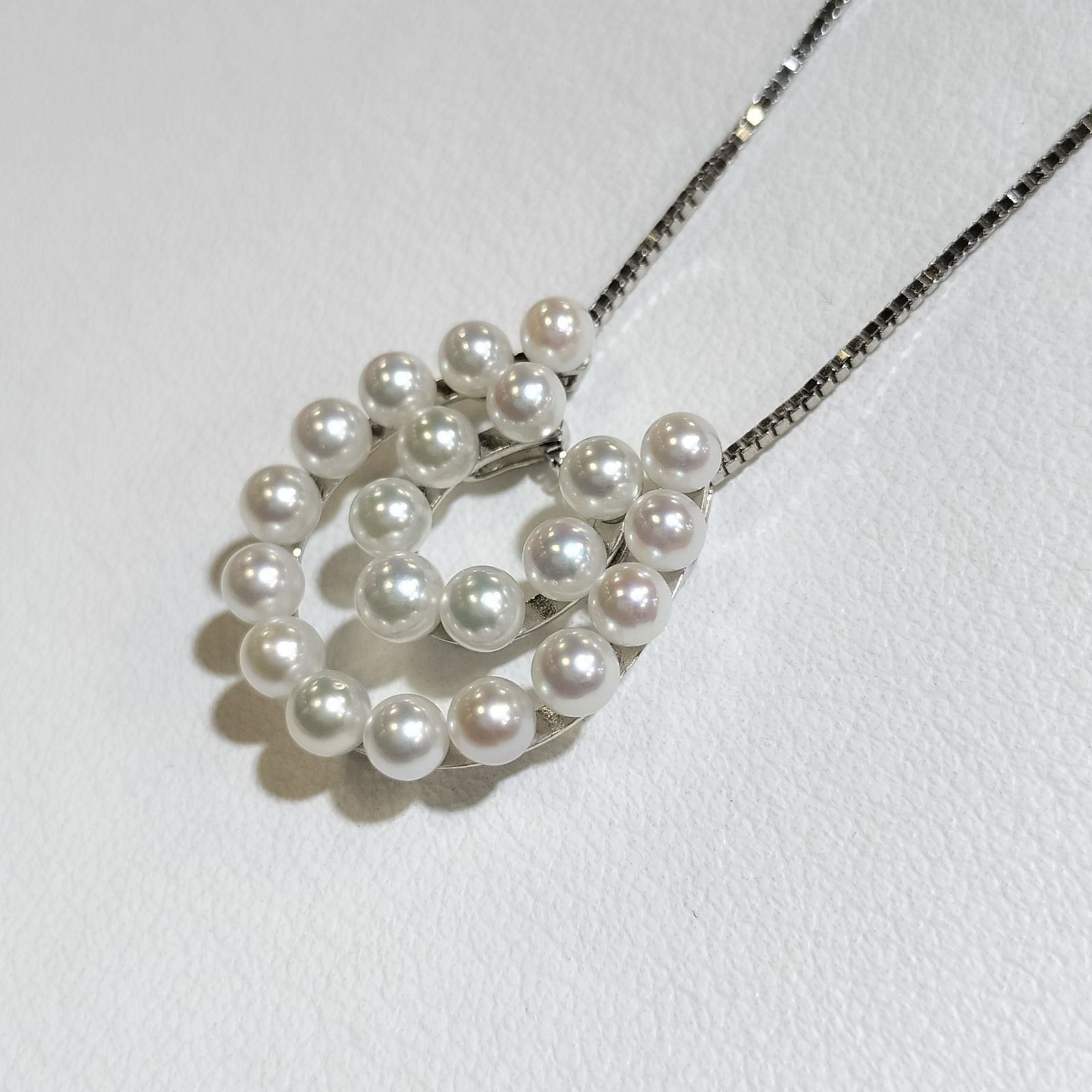 Akwoya Pearl Horseshoe Pendant Necklace with two horseshoe charms and small pearls on a 50cm chain