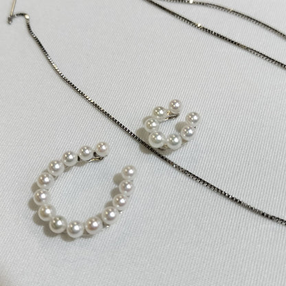 Akwoya Pearl Horseshoe Pendant Necklace with two horseshoe charms and small pearls on a 50cm chain