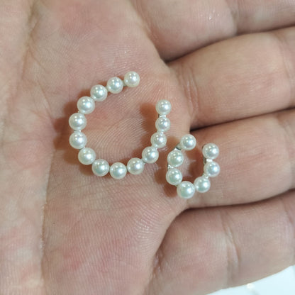 Akwoya Pearl Horseshoe Pendant Necklace with two horseshoe charms and small pearls on a 50cm chain