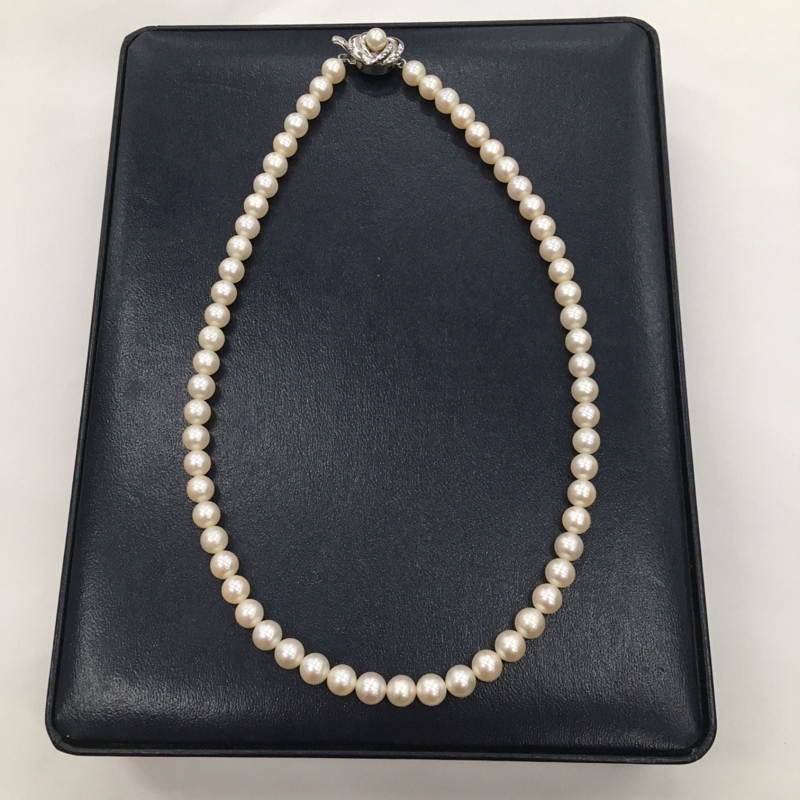 Tasaki Pearl Necklace featuring 7mm pearls in 19cm and 38cm lengths on display