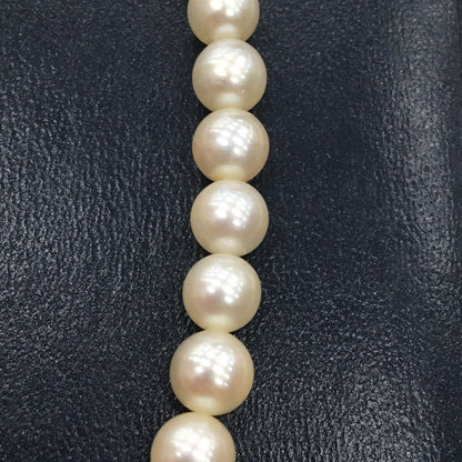 Tasaki Pearl Necklace featuring 7mm pearls in 19cm and 38cm lengths on display