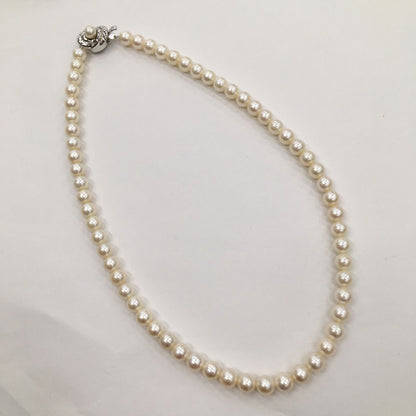 Tasaki Pearl Necklace featuring 7mm pearls in 19cm and 38cm lengths on display