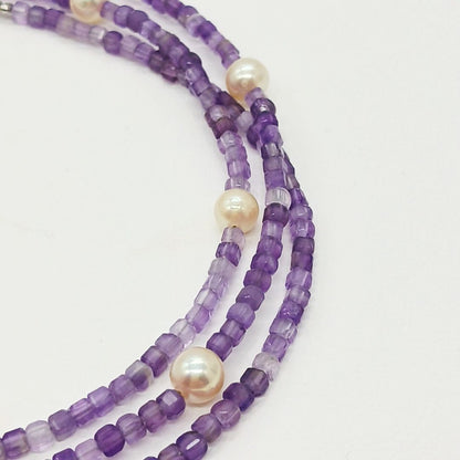 Akoya baby pearl and amethyst necklace with cream pearls and silver chain approximately 73 centimeters long