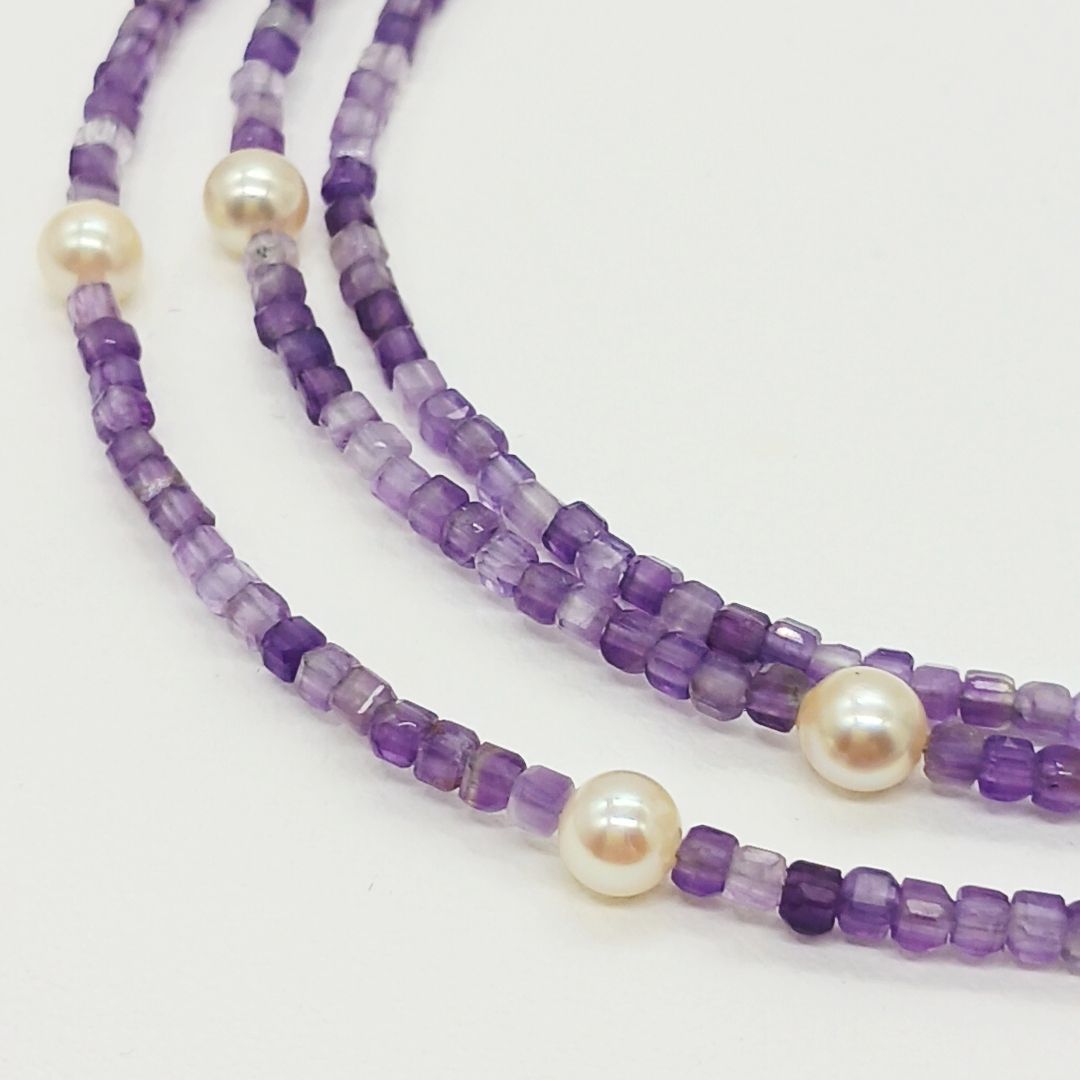 Akoya baby pearl and amethyst necklace with cream pearls and silver chain approximately 73 centimeters long