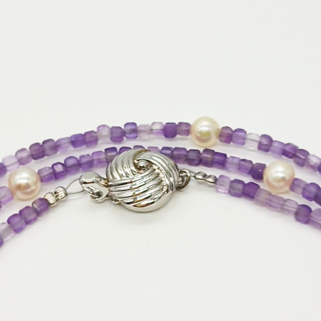 Akoya baby pearl and amethyst necklace with cream pearls and silver chain approximately 73 centimeters long
