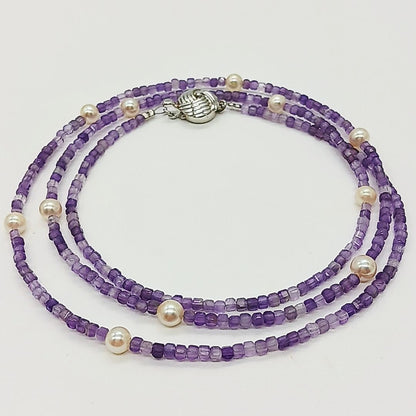 Akoya baby pearl and amethyst necklace with cream pearls and silver chain approximately 73 centimeters long