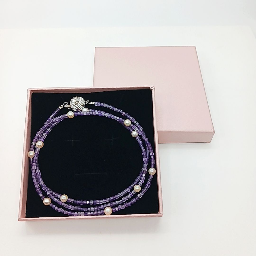 Akoya baby pearl and amethyst necklace with cream pearls and silver chain approximately 73 centimeters long