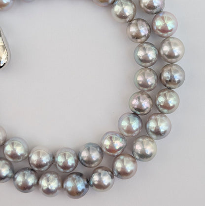 Akoya pearl necklace with natural gray 7-7.5mm pearls and silver fittings displayed on white background