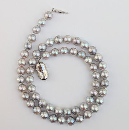 Akoya pearl necklace with natural gray 7-7.5mm pearls and silver fittings displayed on white background