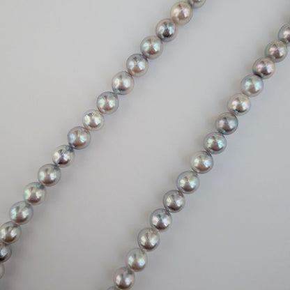 Akoya pearl necklace with natural gray 7-7.5mm pearls and silver fittings displayed on white background