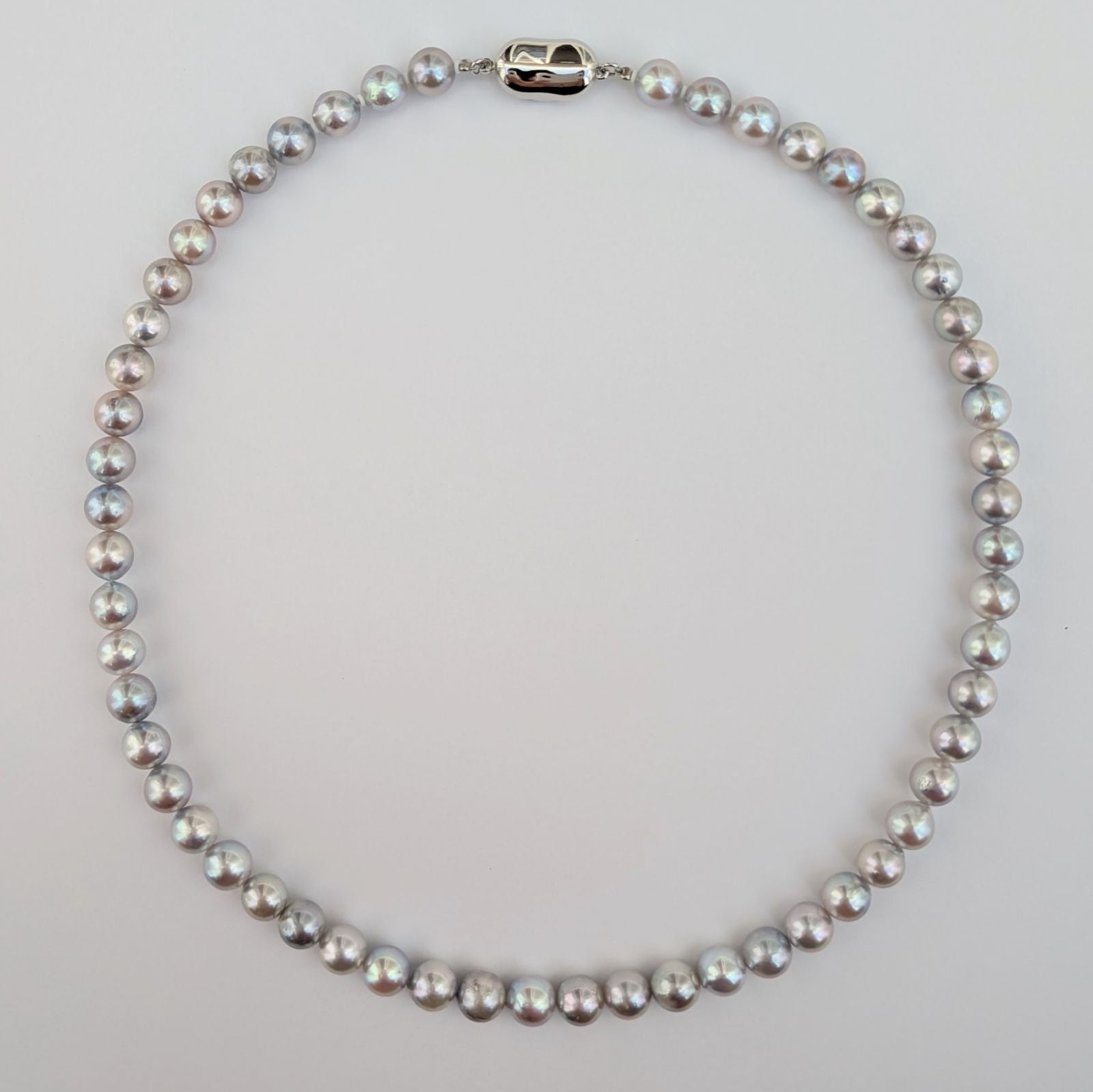 Akoya pearl necklace with natural gray 7-7.5mm pearls and silver fittings displayed on white background