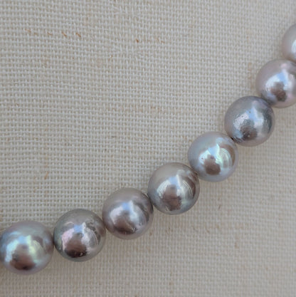 Akoya pearl necklace with natural gray 7-7.5mm pearls and silver fittings displayed on white background