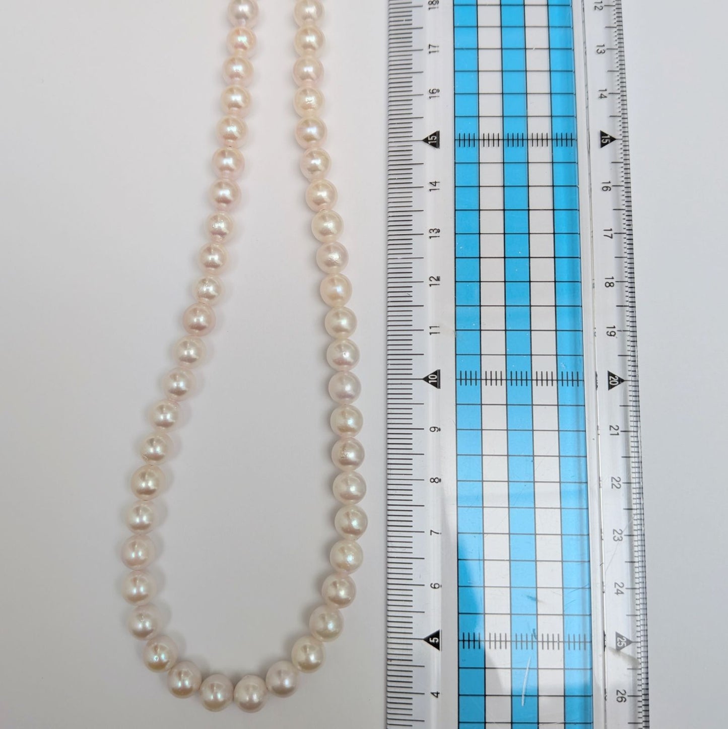 Long Akoya pearl necklace with round 6.5-7mm pink tone pearls and silver clasp, 82 cm length