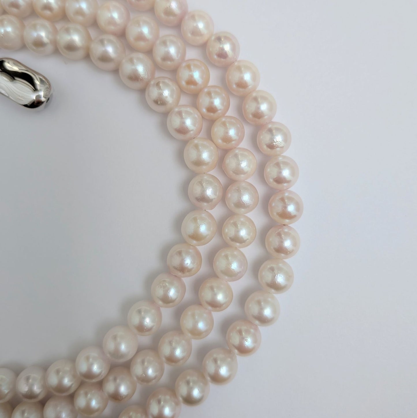 Long Akoya pearl necklace with round 6.5-7mm pink tone pearls and silver clasp, 82 cm length