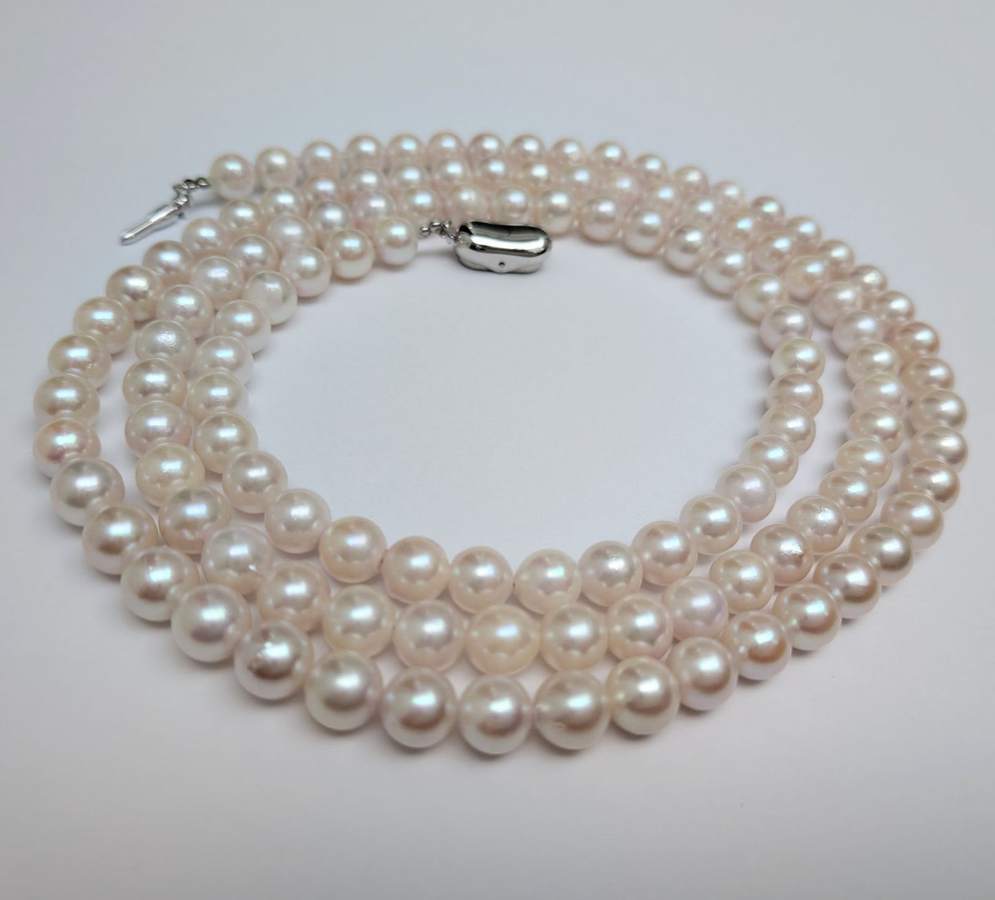 Long Akoya pearl necklace with round 6.5-7mm pink tone pearls and silver clasp, 82 cm length