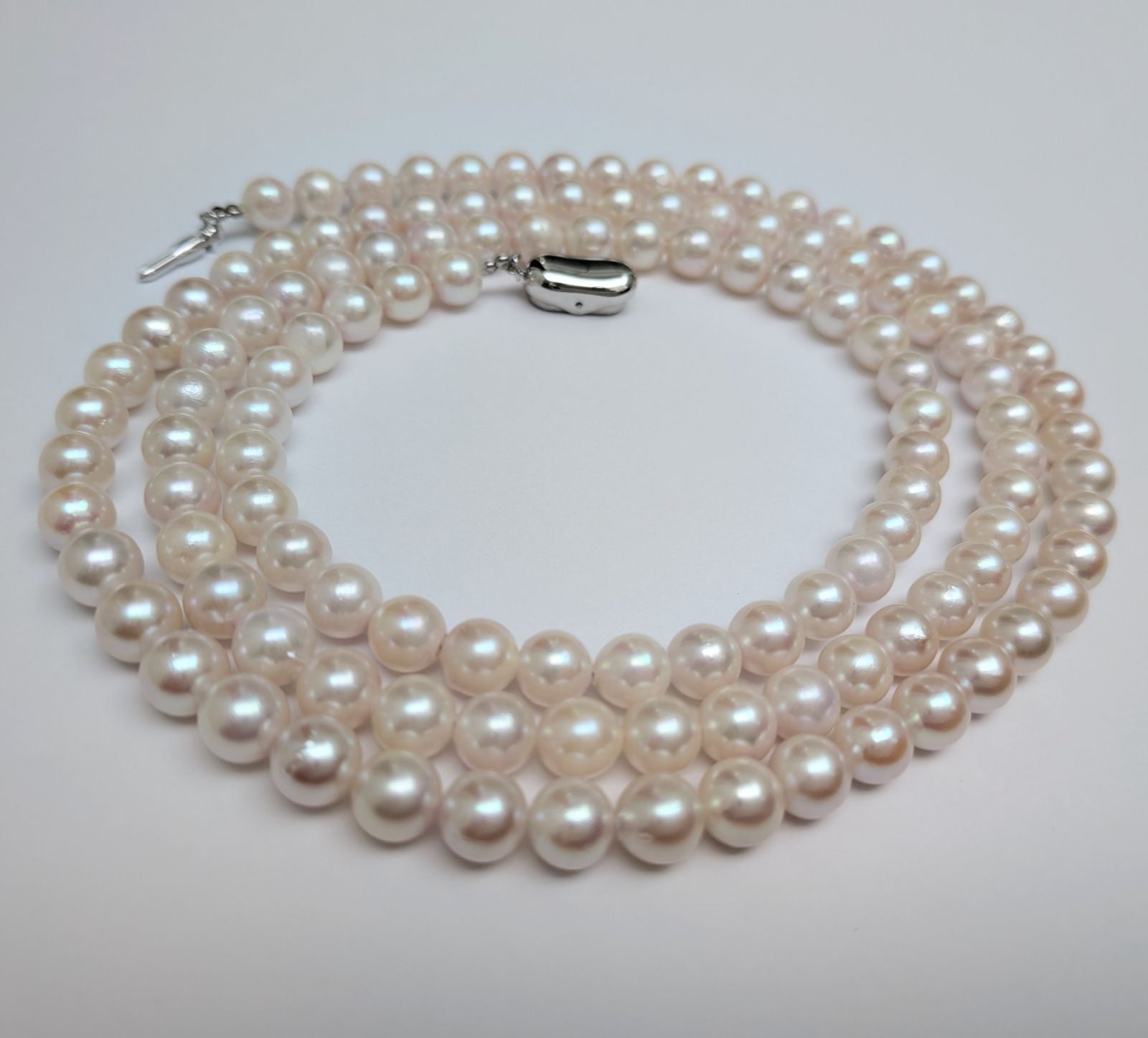 Long Akoya pearl necklace with round 6.5-7mm pink tone pearls and silver clasp, 82 cm length