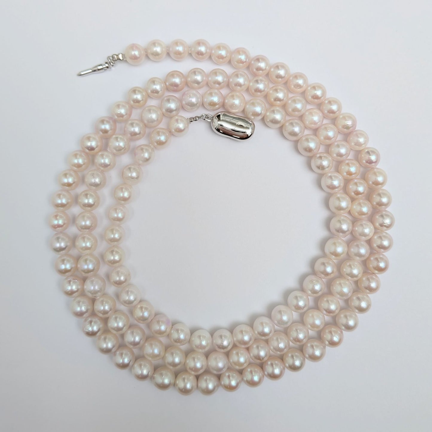 Long Akoya pearl necklace with round 6.5-7mm pink tone pearls and silver clasp, 82 cm length