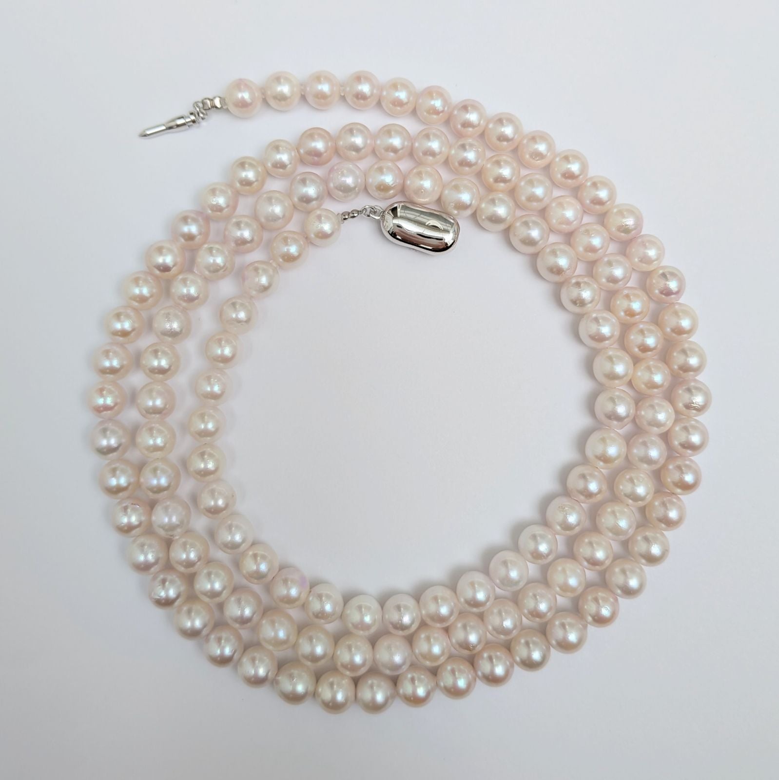 Long Akoya pearl necklace with round 6.5-7mm pink tone pearls and silver clasp, 82 cm length