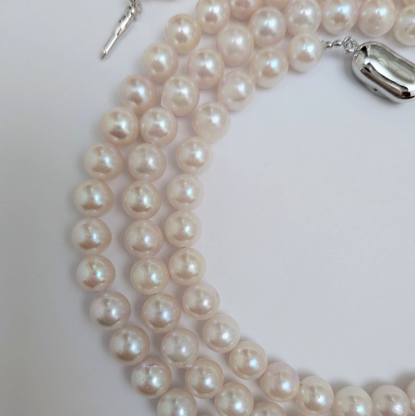 Long Akoya pearl necklace with round 6.5-7mm pink tone pearls and silver clasp, 82 cm length