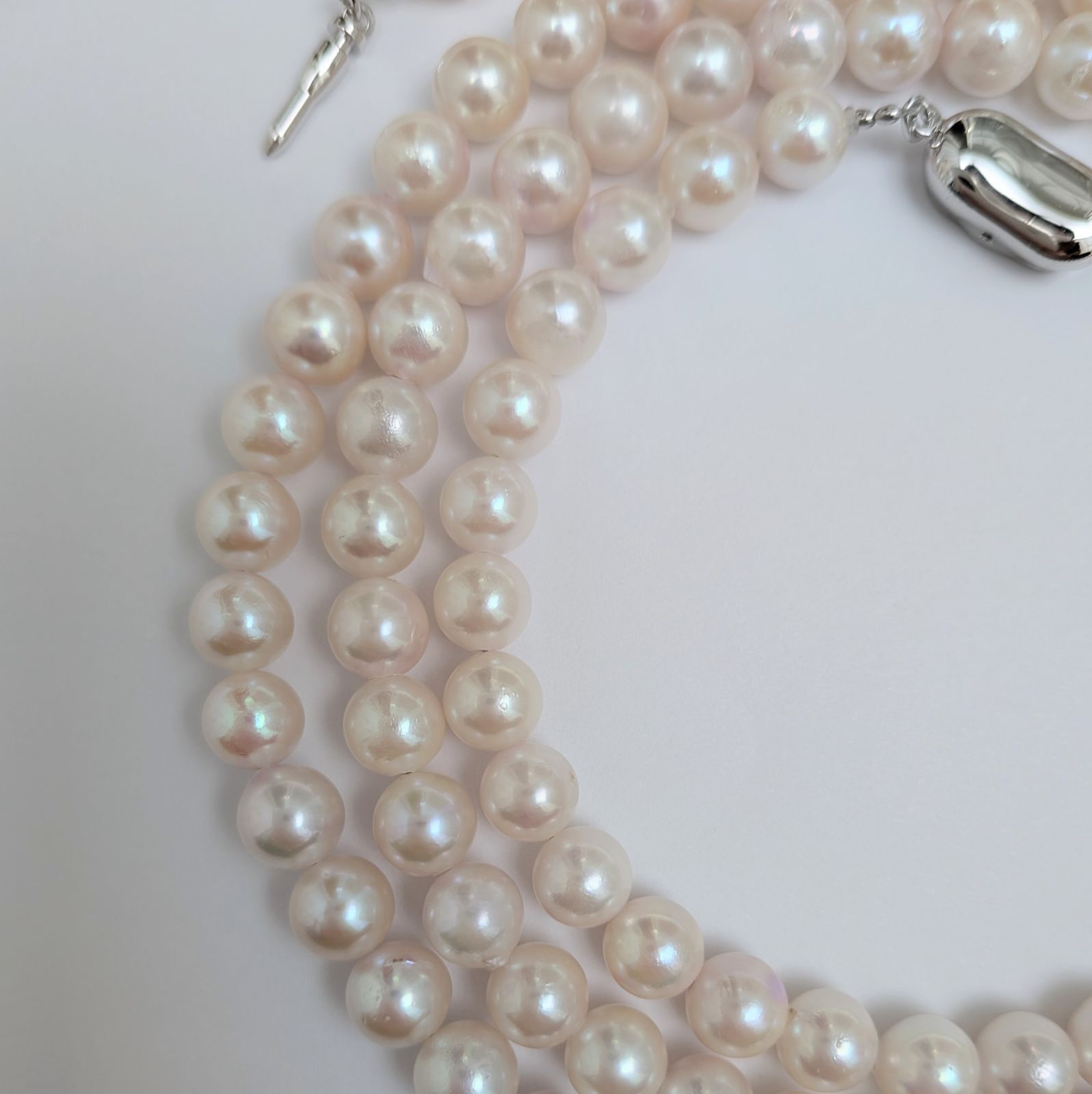 Long Akoya pearl necklace with round 6.5-7mm pink tone pearls and silver clasp, 82 cm length