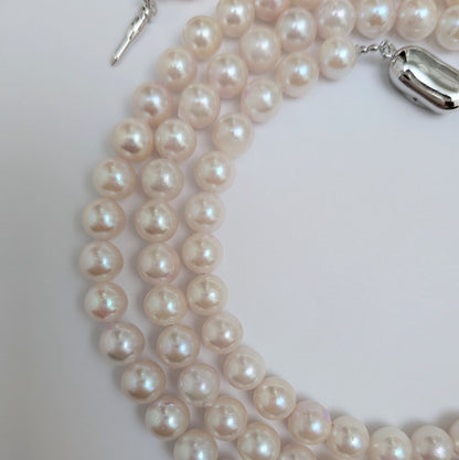 Long Akoya pearl necklace with round 6.5-7mm pink tone pearls and silver clasp, 82 cm length
