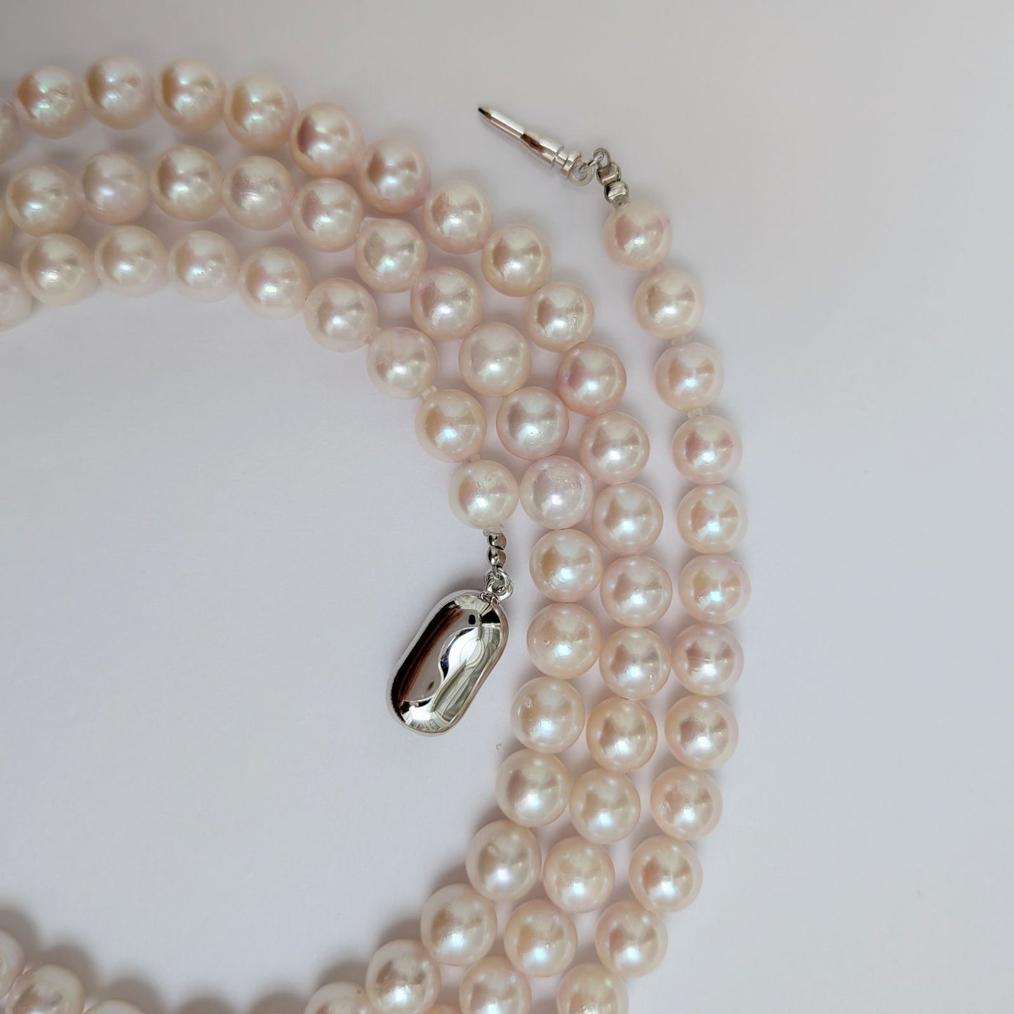 Long Akoya pearl necklace with round 6.5-7mm pink tone pearls and silver clasp, 82 cm length