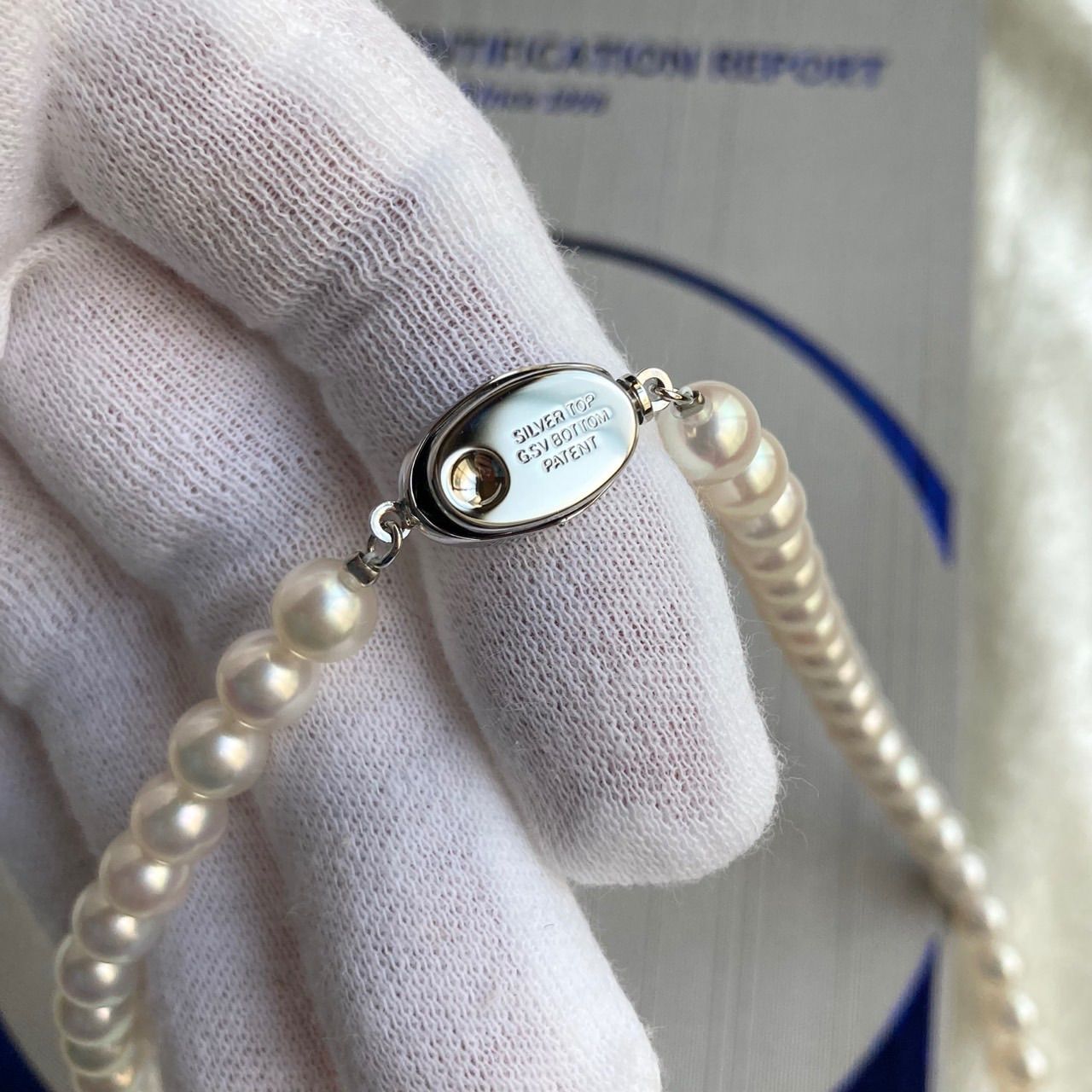 Akoya pearl necklace 40cm length with 6.5-7.0mm pearls and silver clasp displayed with certificate and case