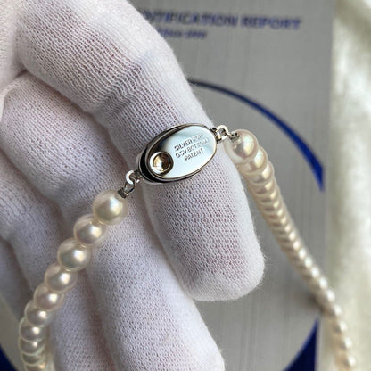 Akoya pearl necklace 40cm length with 6.5-7.0mm pearls and silver clasp displayed with certificate and case