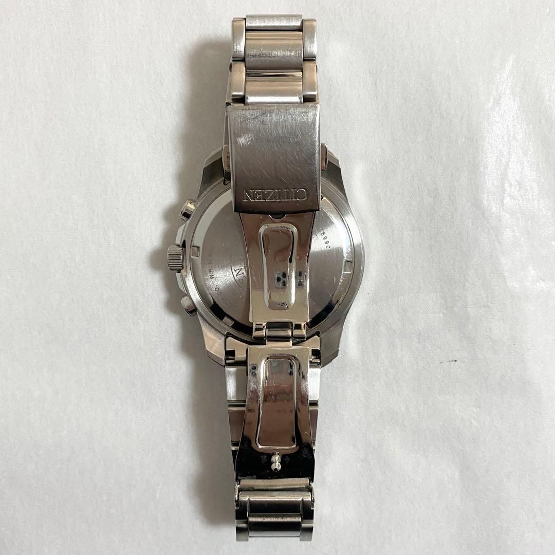 CITIZEN Eco-Drive Perpetual Calendar men's watch model E820-R006592 with silver case and black leather strap