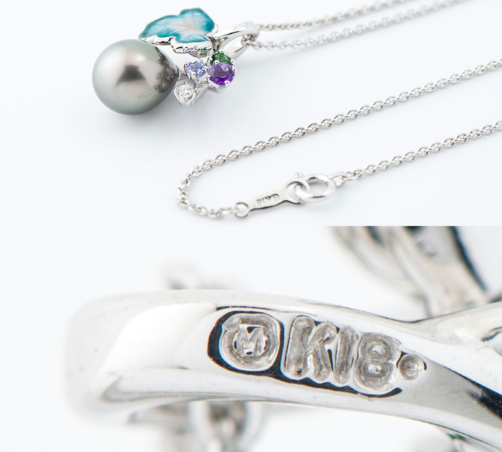 Mikimoto pendant necklace with drop-shaped black South Sea pearl and botanical motif in 18K white gold