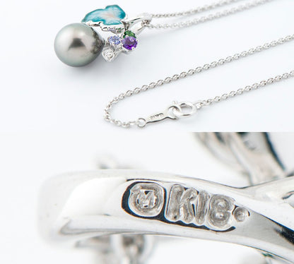 Mikimoto pendant necklace with drop-shaped black South Sea pearl and botanical motif in 18K white gold