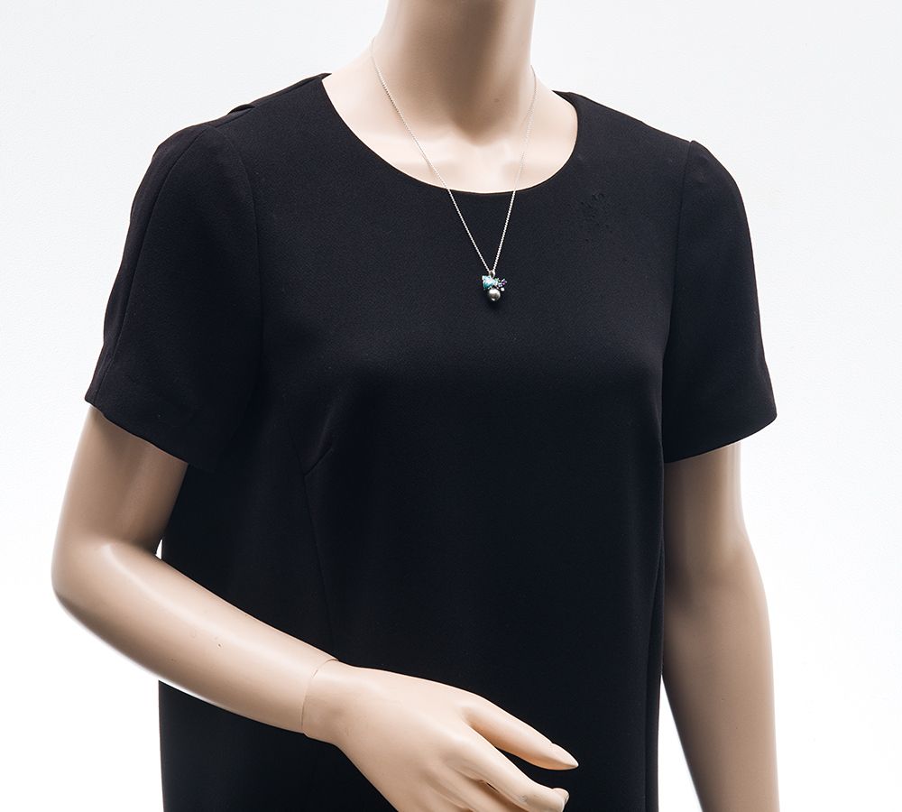 Mikimoto pendant necklace with drop-shaped black South Sea pearl and botanical motif in 18K white gold