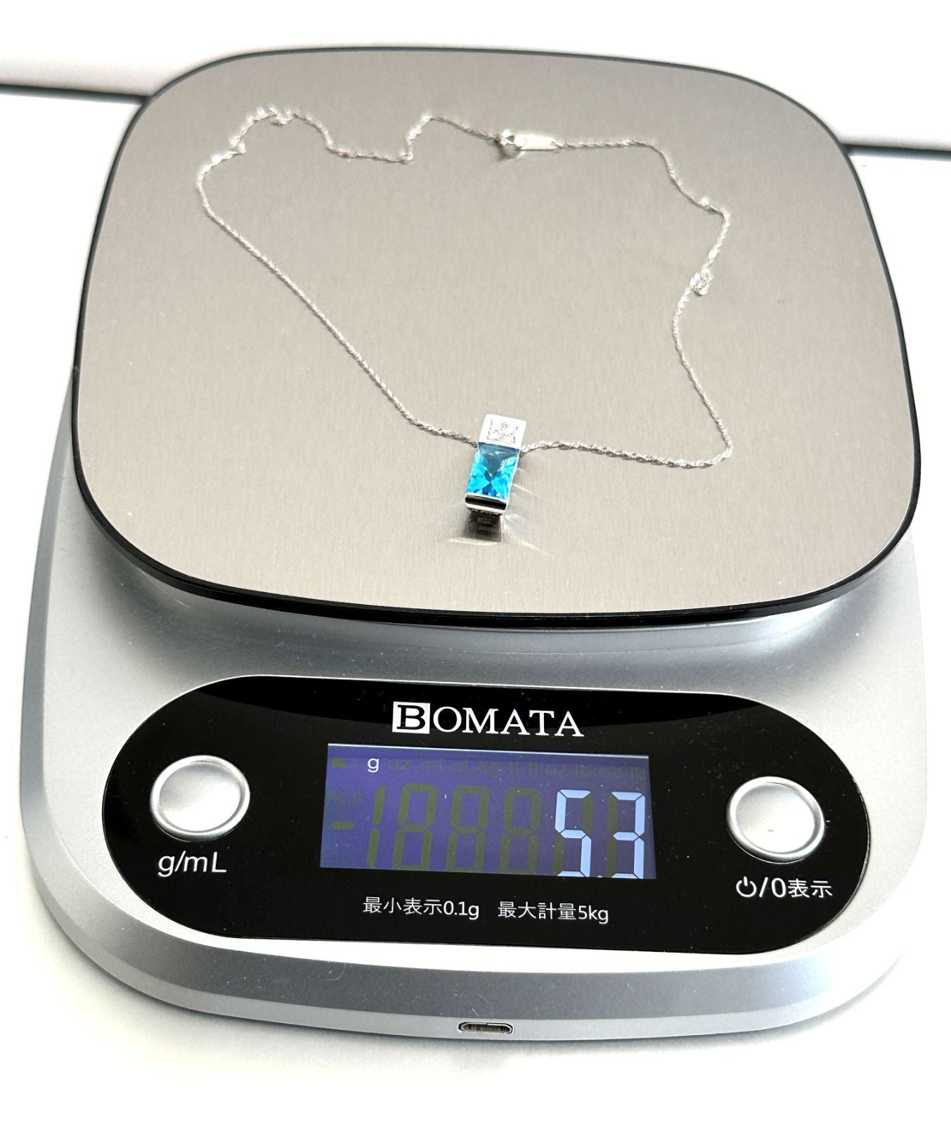 TASAKI necklace featuring a pearl, blue topaz gemstone, and 0.11ct diamonds on a 40cm chain