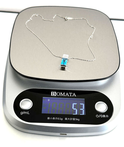 TASAKI necklace featuring a pearl, blue topaz gemstone, and 0.11ct diamonds on a 40cm chain