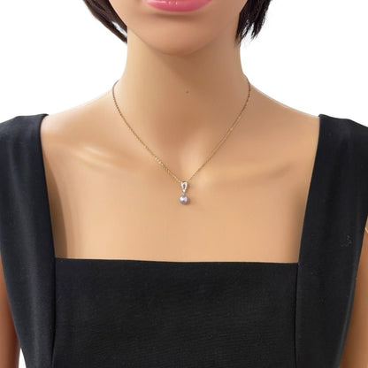 Tasaki 18K white gold pendant top with pearl and small diamond on silver chain
