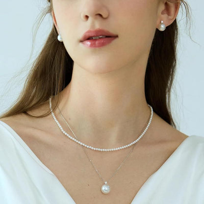 New Yachihoko Baby Pearl Necklace with 3-3.5 mm freshwater pearls and silver clasp on white background