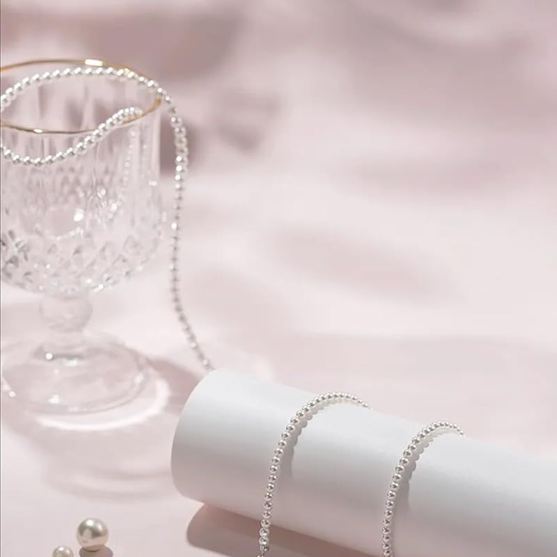 New Yachihoko Baby Pearl Necklace with 3-3.5 mm freshwater pearls and silver clasp on white background